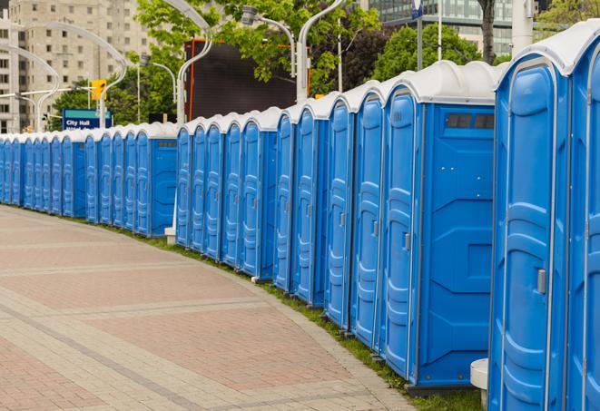 a row of portable restrooms at a fairground, offering visitors a clean and hassle-free experience in idanha
